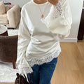 Round neck solid color long sleeved irregular hem T-shirt for women